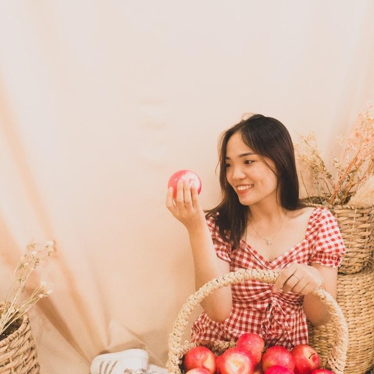 Avery Collins, Lead Design Curator at EchoTideCortex, reviewing corporate floral arrangements